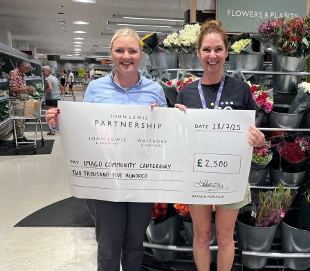 a big cheque for £2,500 made out to Imago on behalf of Waitrose and Partners